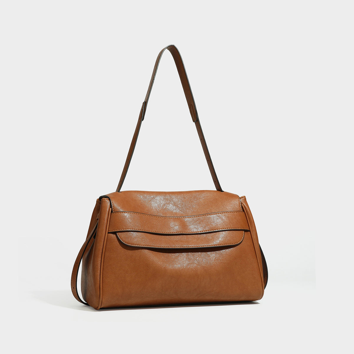 Structured rectangular dark brown leather-look flap shoulder bag with layered front detail and long adjustable strap, front