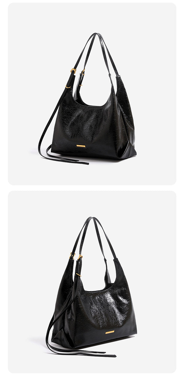 Slouchy hobo shoulder bag in crinkle high-gloss leather-look finish with gold-tone bar hardware and adjustable strap, detail
