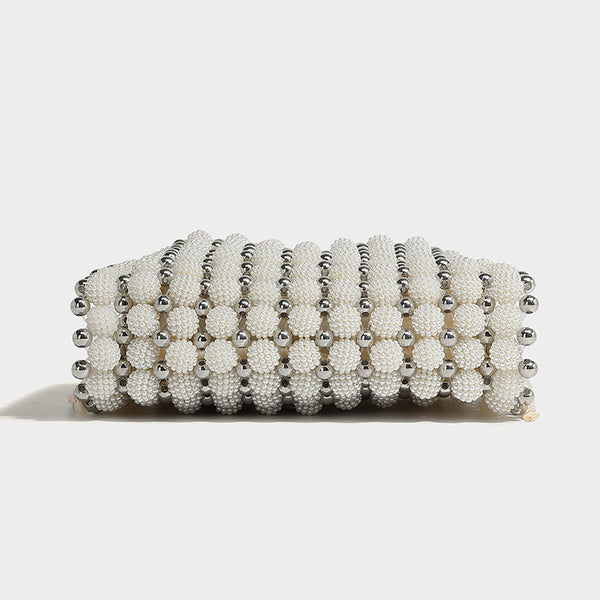 Small boxy pearl-bead mini top-handle bag with silver metallic bead accents, satin floral detail, and long beaded shoulder