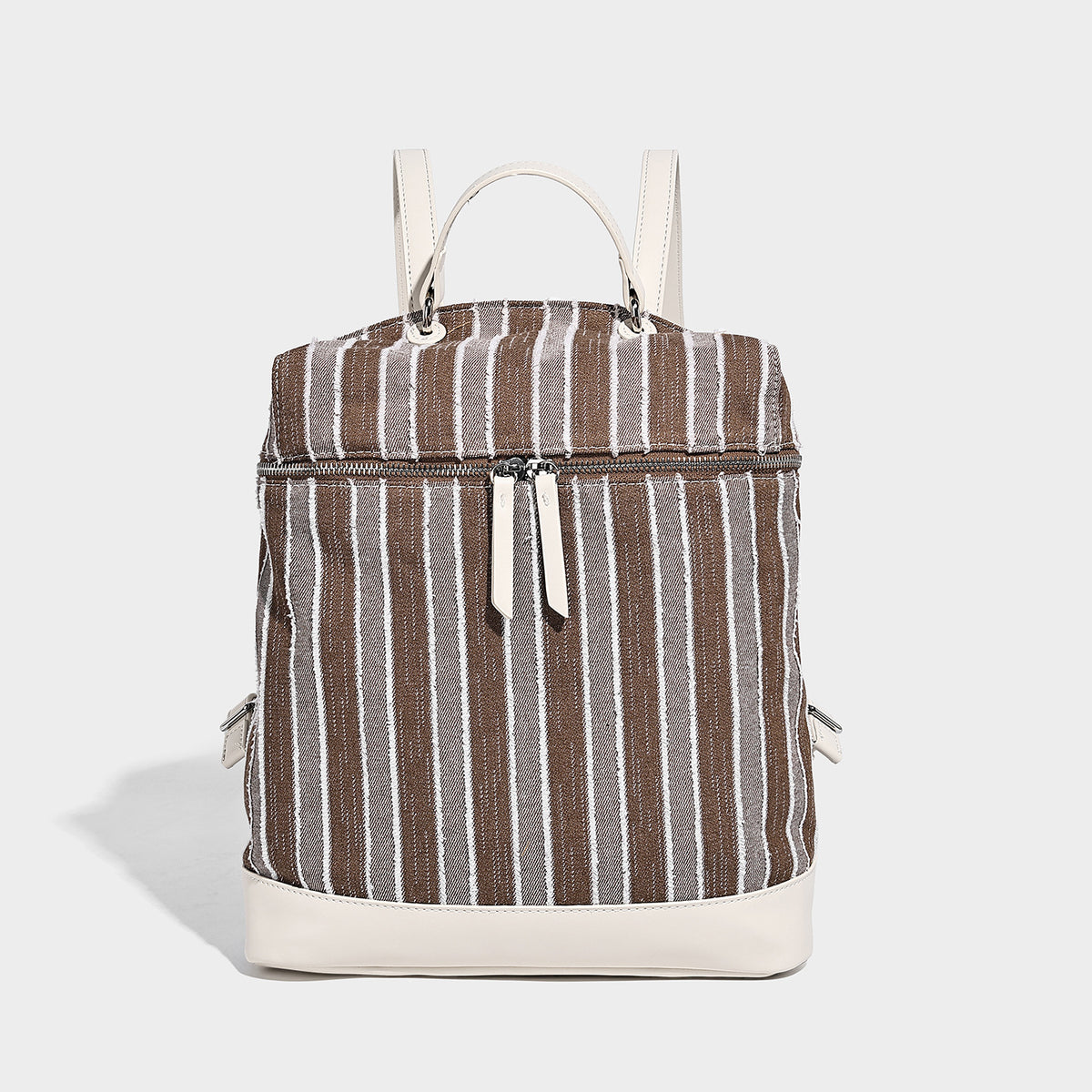 Small structured striped fabric backpack handbag with cream leather-look trim, top handle, and silver-tone hardware, detail