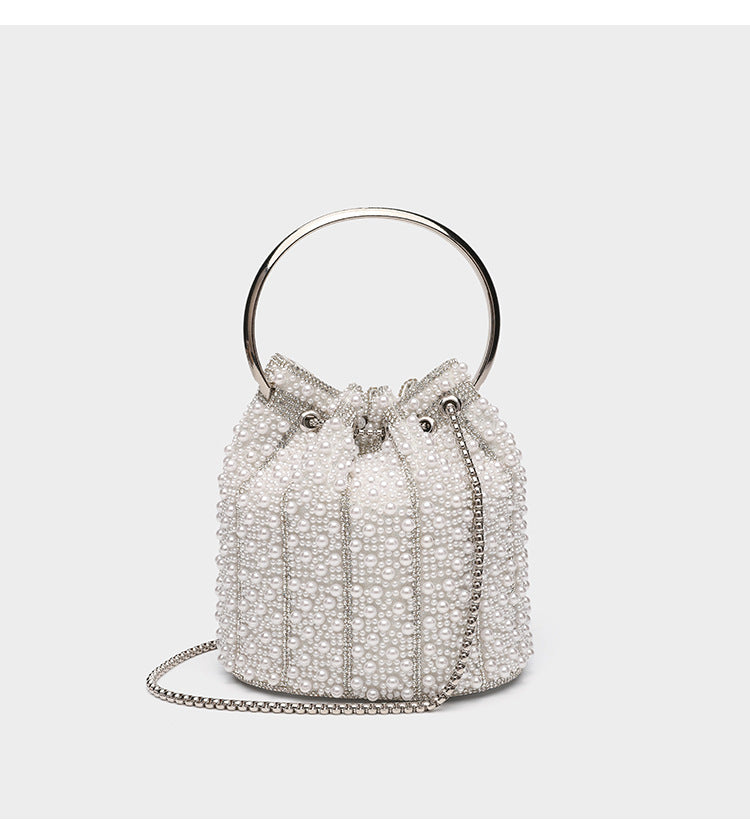Small pearl-beaded drawstring bucket bag with silver-tone ring top handle and chain shoulder strap, detail view 13