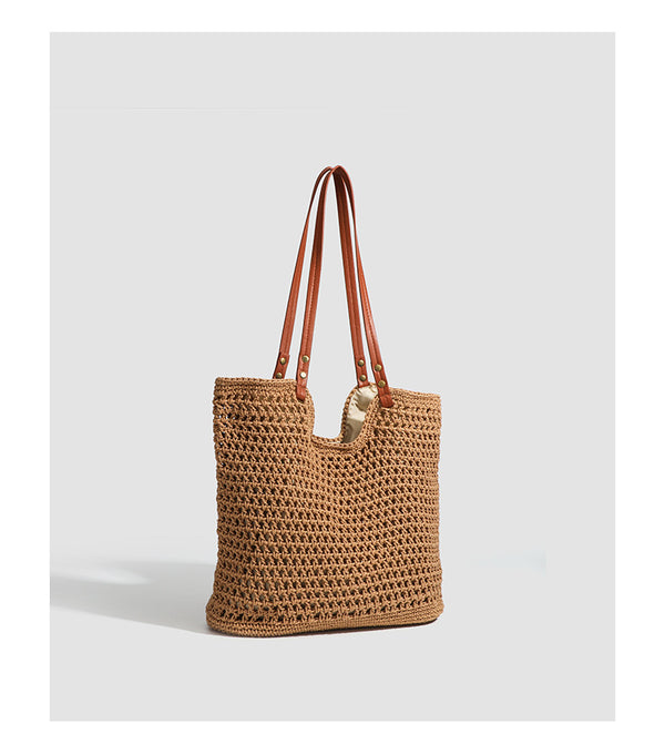 Open-knit woven tote bag with leather-look shoulder straps and brass-tone hardware in off-white, detail view 10