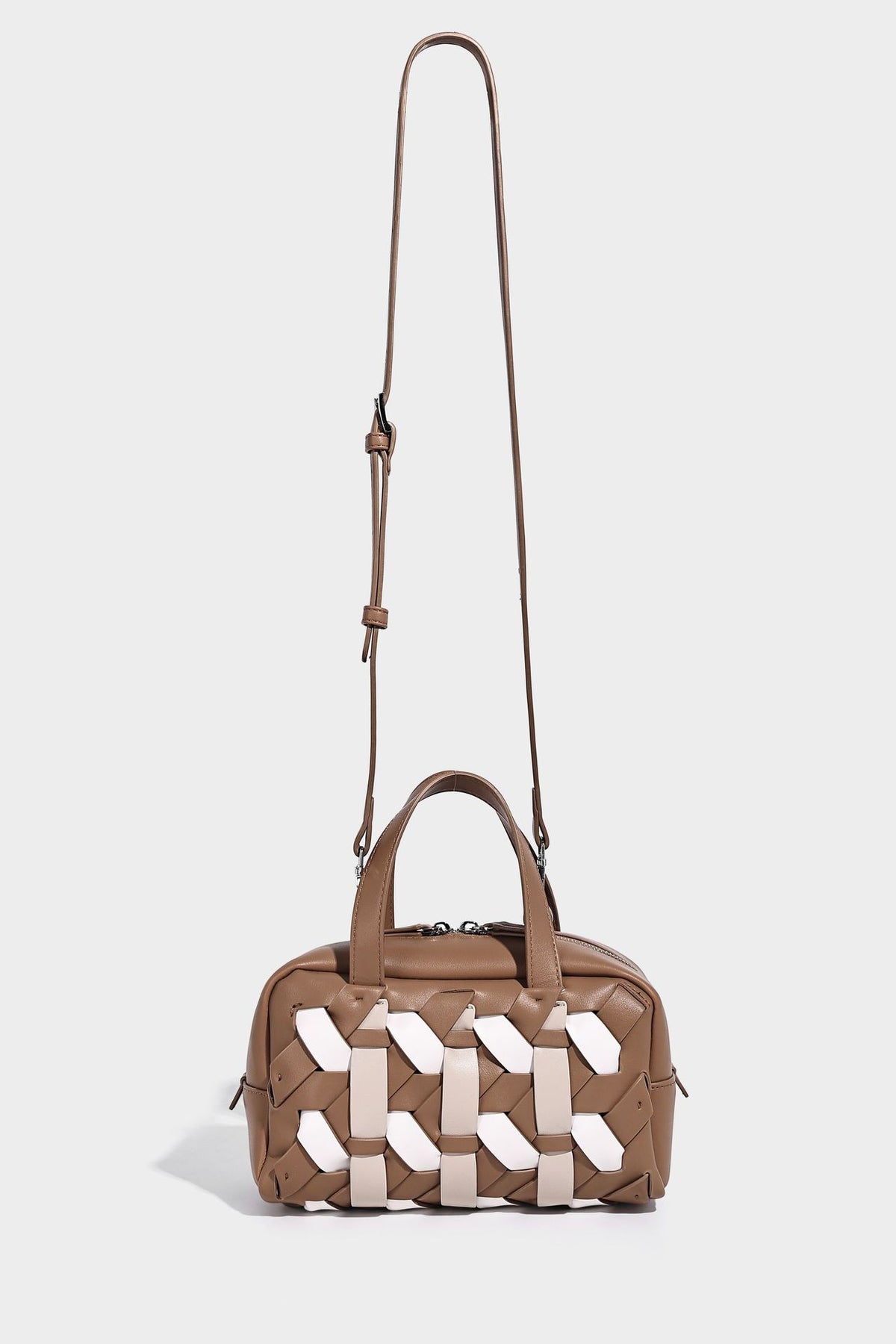 Small structured satchel bag with two-tone woven front panel, dual top handles, and detachable crossbody strap in tan brown