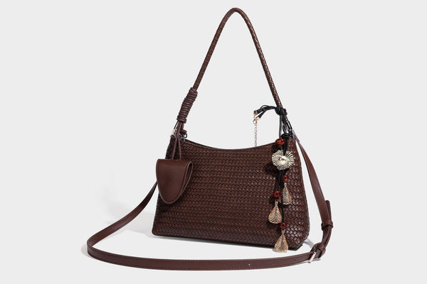 Woven-texture hobo shoulder bag in brown with braided top handle, adjustable crossbody strap, front flap pocket, and, detail