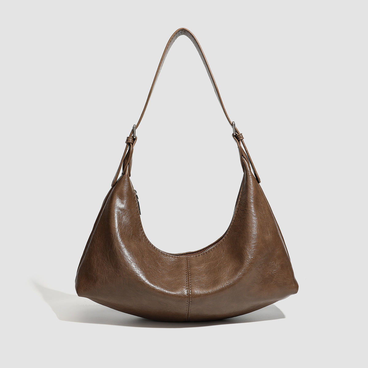 Slouchy crescent hobo shoulder bag with zip-top closure and adjustable strap, detail view 7
