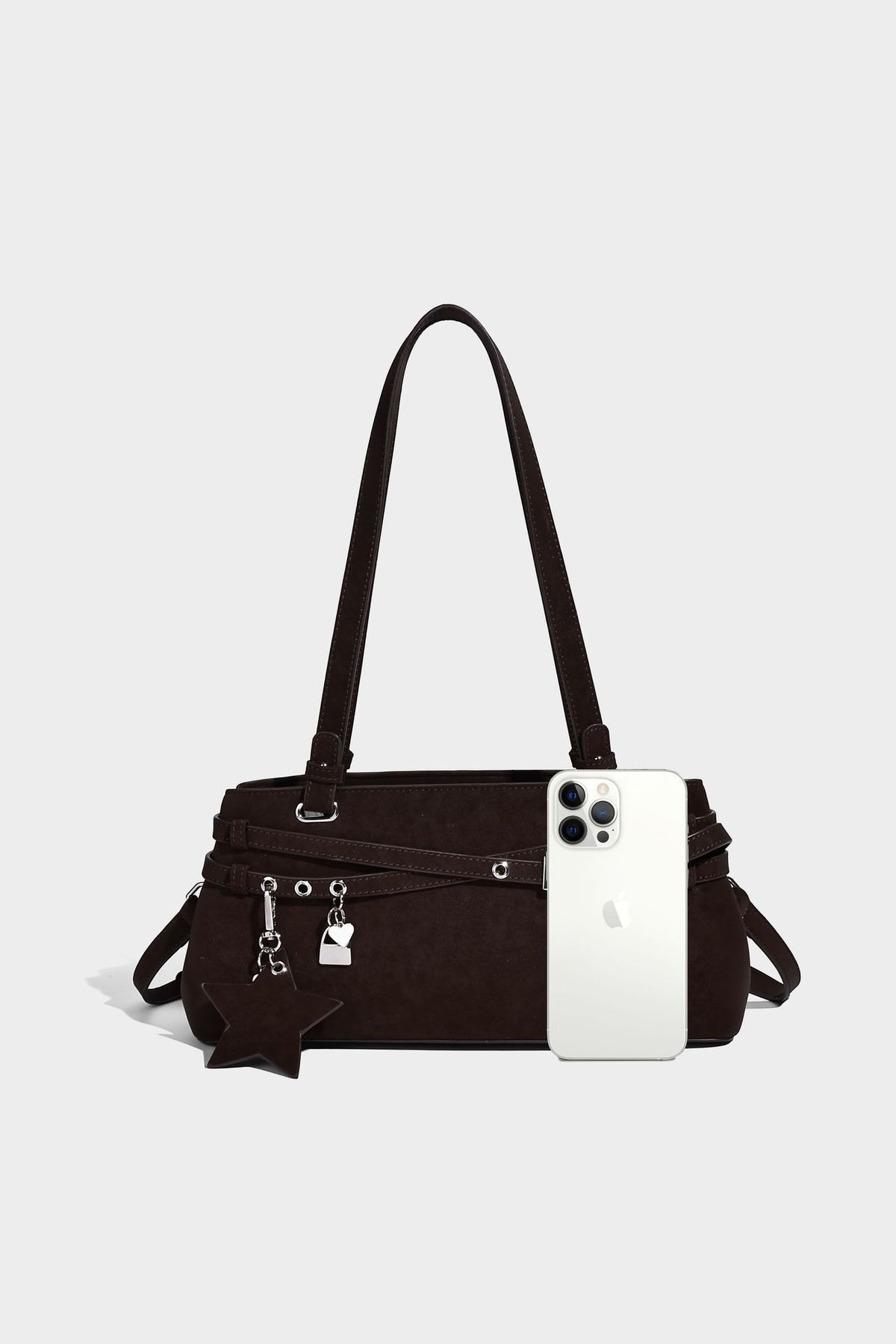 Structured trapezoid shoulder tote in dark brown matte suede-look finish with dual straps, wraparound belt bands