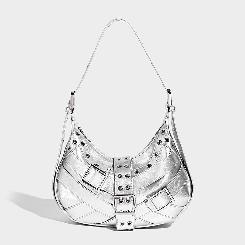 Glossy crescent hobo bag with silver-tone grommets, square buckle straps, and top zipper closure, detail view 3