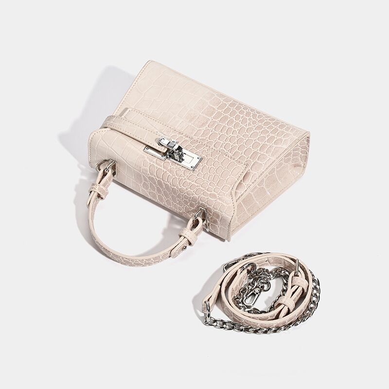 Croc-embossed mini top-handle satchel with silver turn-lock closure and adjustable crossbody strap, detail view 4