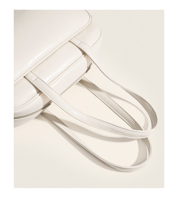Large structured rectangular leather-look shoulder bag with dual zip compartments and double top handles, detail view 11