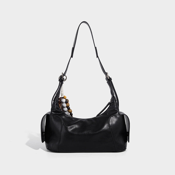 Soft pebbled leather-look hobo shoulder bag with zip top closure, side flap pockets, and silver-tone hardware, detail view 3