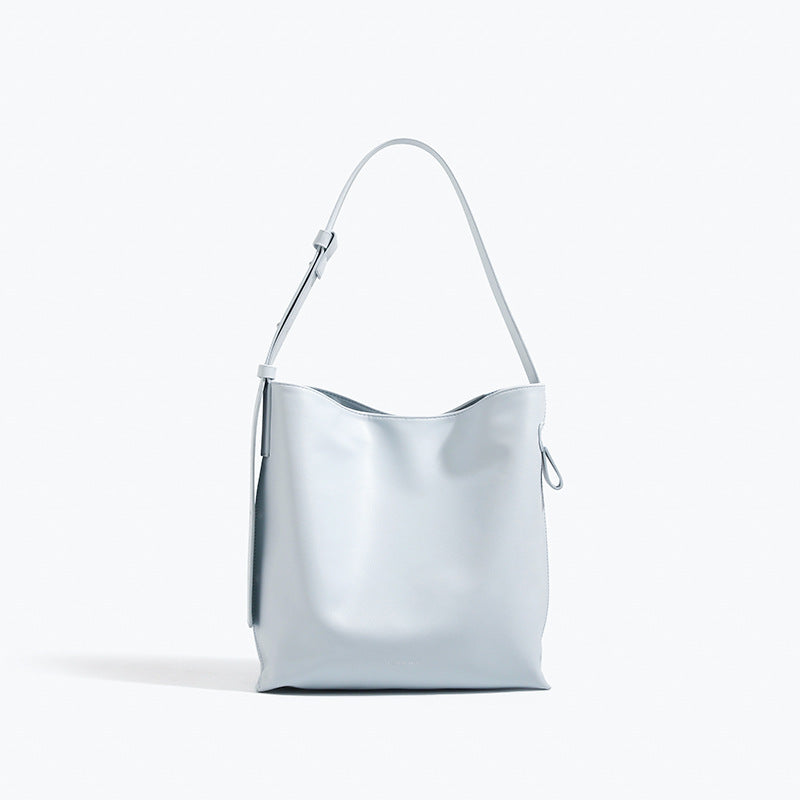 Glossy leather-look oversized shoulder tote bag with wide flat strap and soft rectangular silhouette, detail view 8