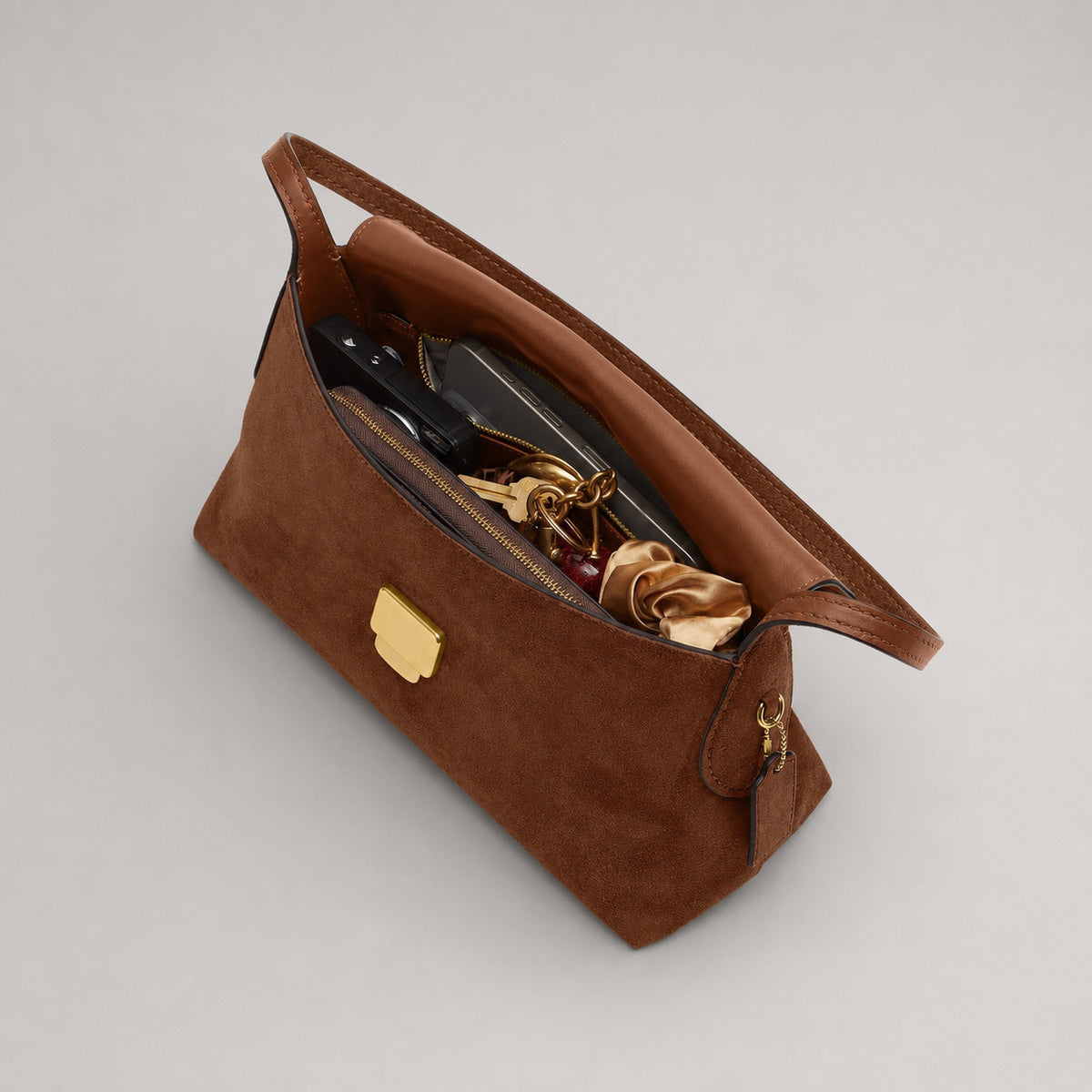 Rectangular matte suede-finish flap shoulder bag with slim dark strap and gold-tone turn-lock hardware, detail view 3
