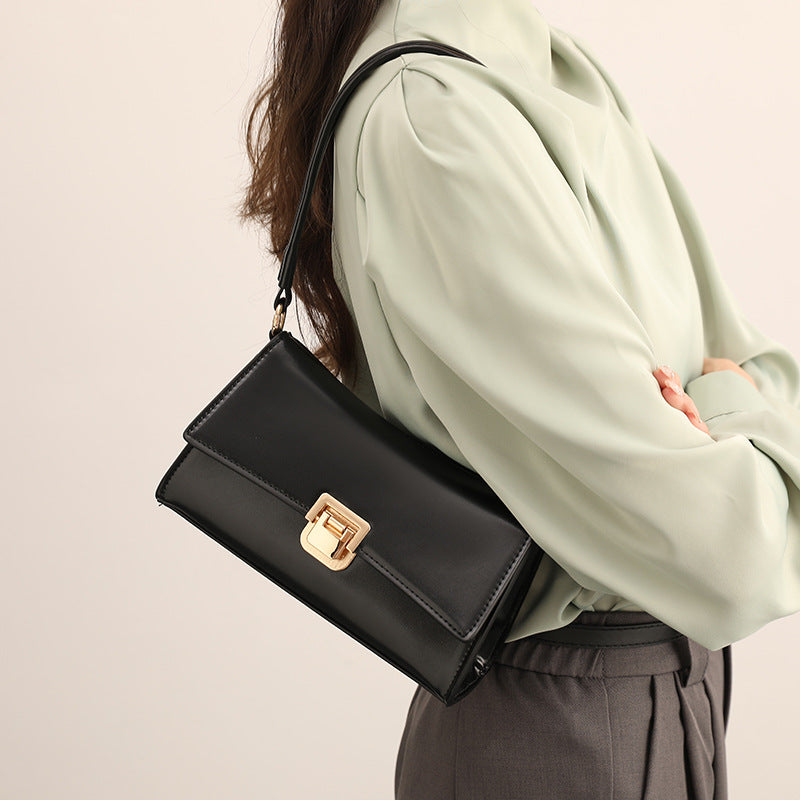Compact structured flap shoulder bag with gold-tone turn-lock closure and adjustable strap, detail view 2
