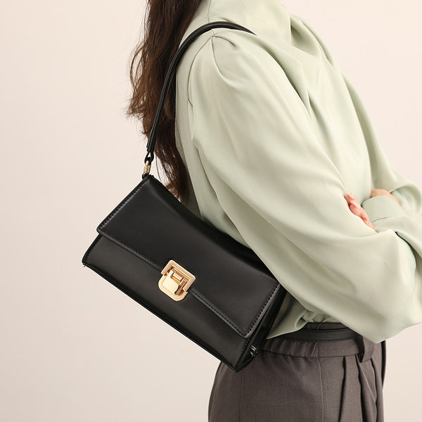 Compact structured flap shoulder bag with gold-tone turn-lock closure and adjustable strap, detail view 2