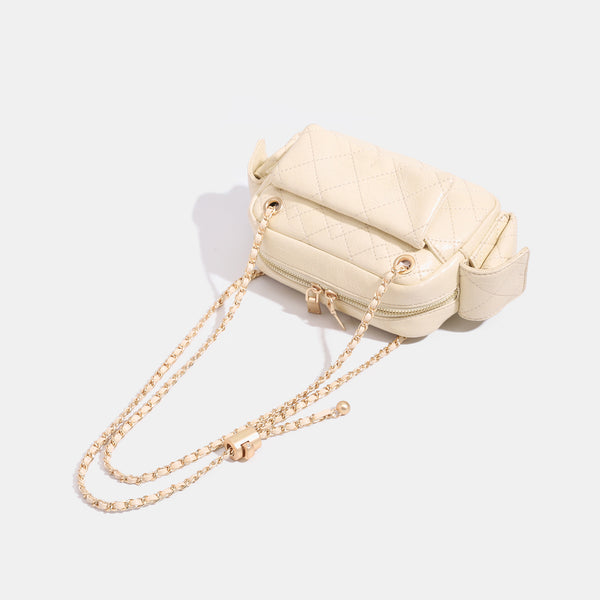Compact quilted diamond-stitch crossbody bag with gold-tone chain strap and top zip closure, detail view 4