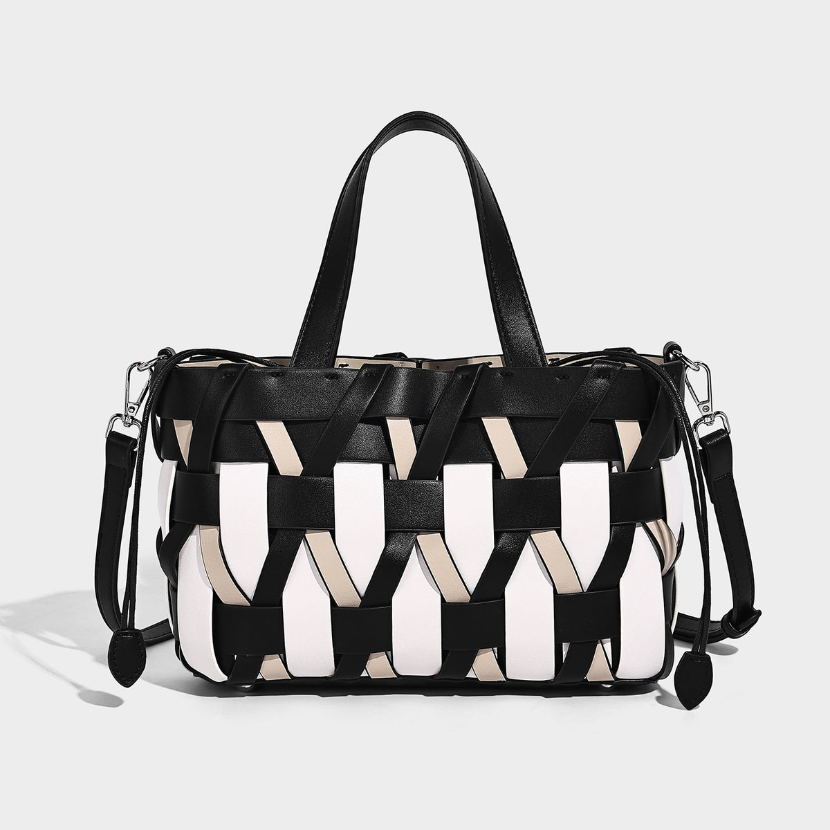 Small structured woven lattice tote bag with dual top handles and detachable shoulder strap in brown and cream leather-look