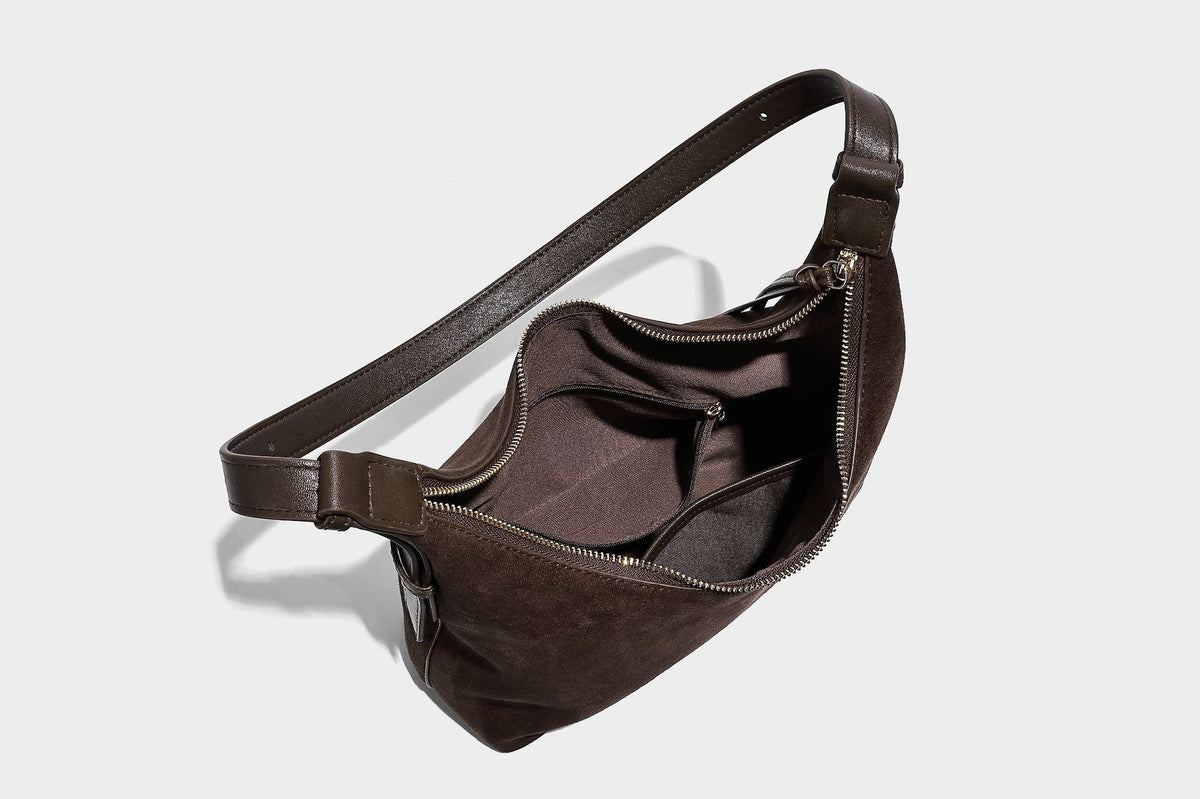 Dark brown suede-look hobo shoulder bag with top zip closure, adjustable strap, and small detachable mini pouch, detail view