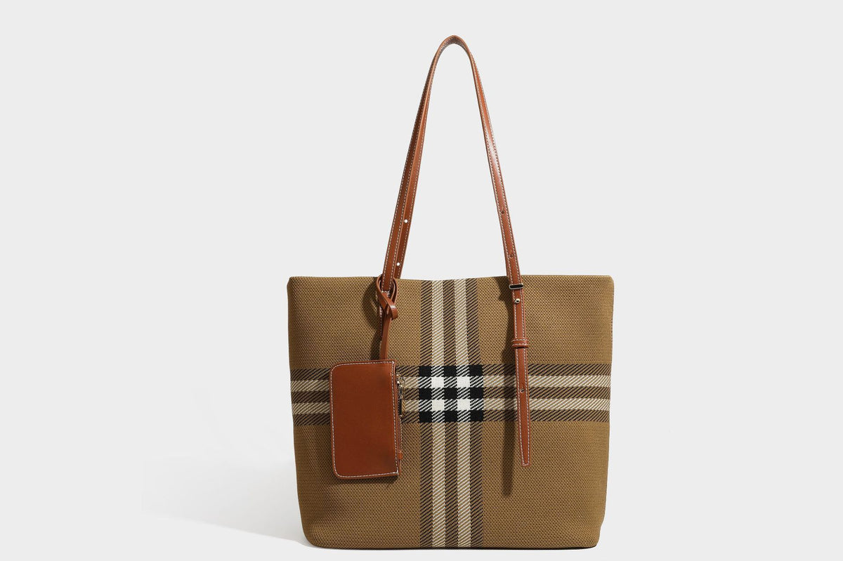 Large structured plaid check tote bag with smooth tan leather-look shoulder straps, attached front zip pouch, and gold-tone