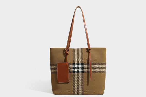 Large structured plaid check tote bag with smooth tan leather-look shoulder straps, attached front zip pouch, and gold-tone