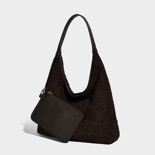 Large slouchy woven hobo tote bag with curved shoulder strap and triangular silhouette, front view