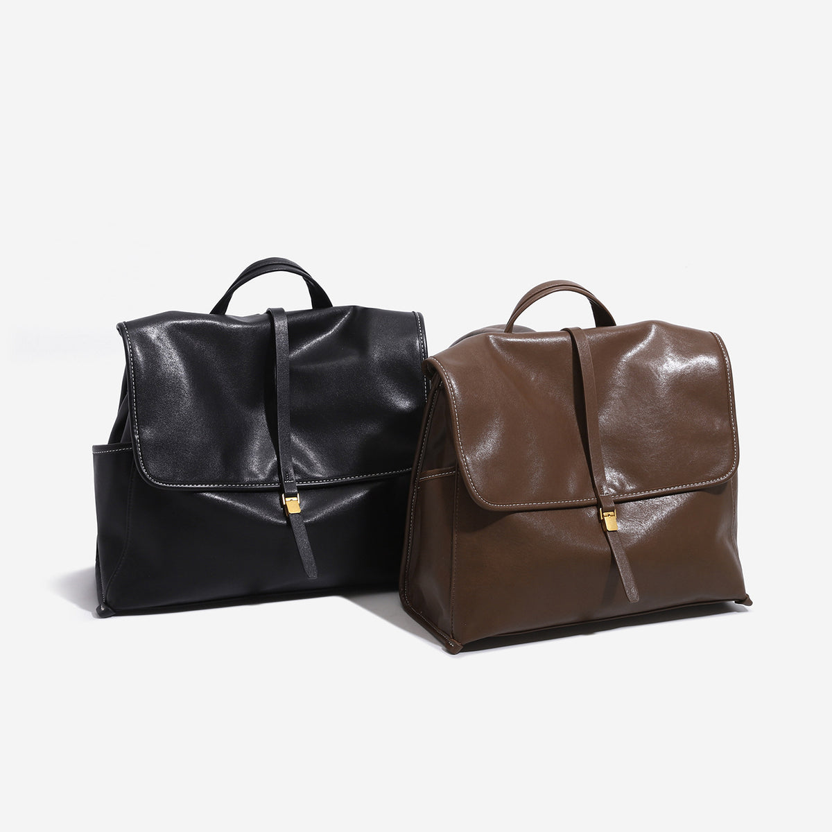 Structured retro flap backpack handbag in brown leather-look finish with gold-tone toggle clasp and top handle, front view