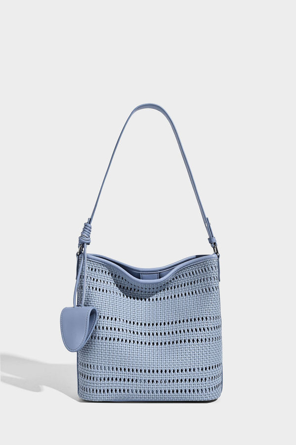 Handwoven open-weave shoulder bag with leather-look trim, knotted adjustable strap, and clip-on sunglasses sleeve pouch