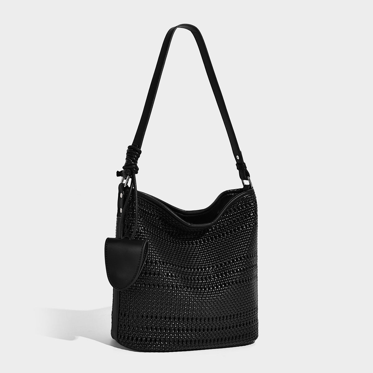 Handwoven open-weave shoulder bag with leather-look trim, knotted adjustable strap, and clip-on sunglasses sleeve pouch