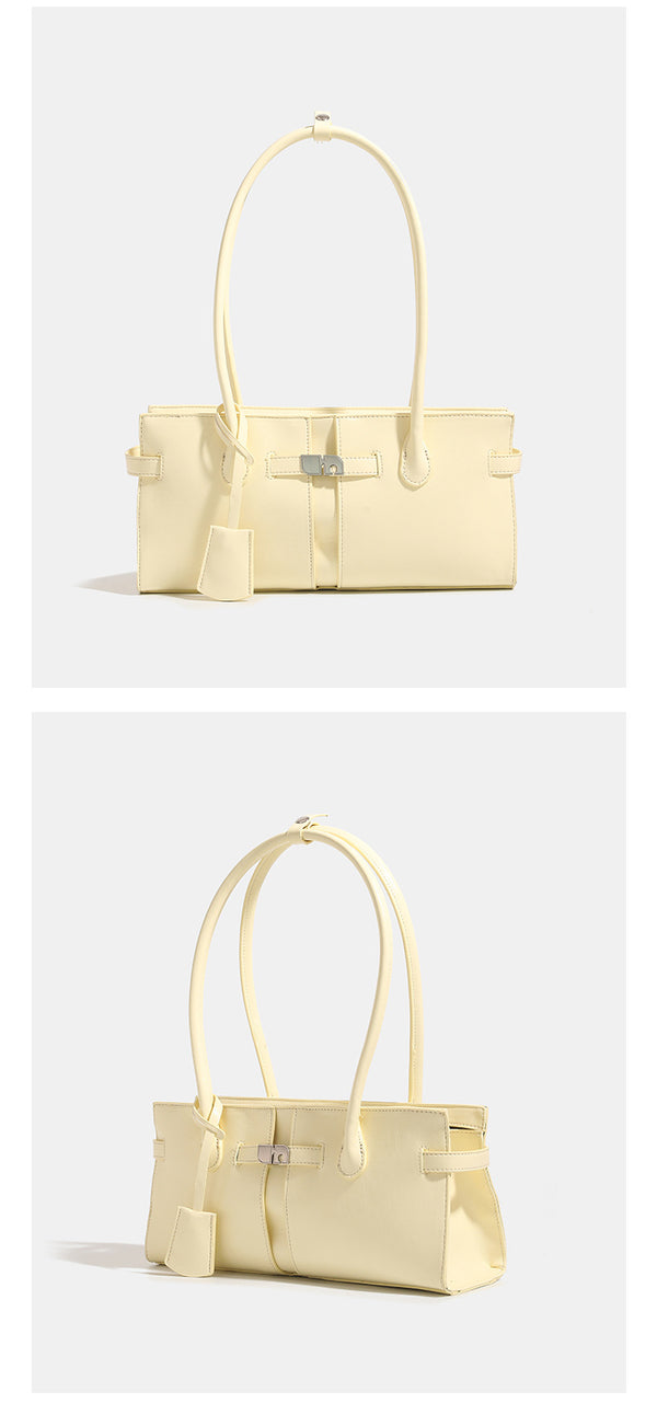 Structured glossy leather-look tote bag with long loop handles and silver turn-lock buckle closure, detail view 9