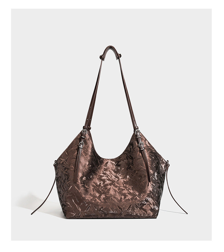 Slouchy crinkle-finish shoulder tote bag with silver hardware and attached zip pouch, detail view 11