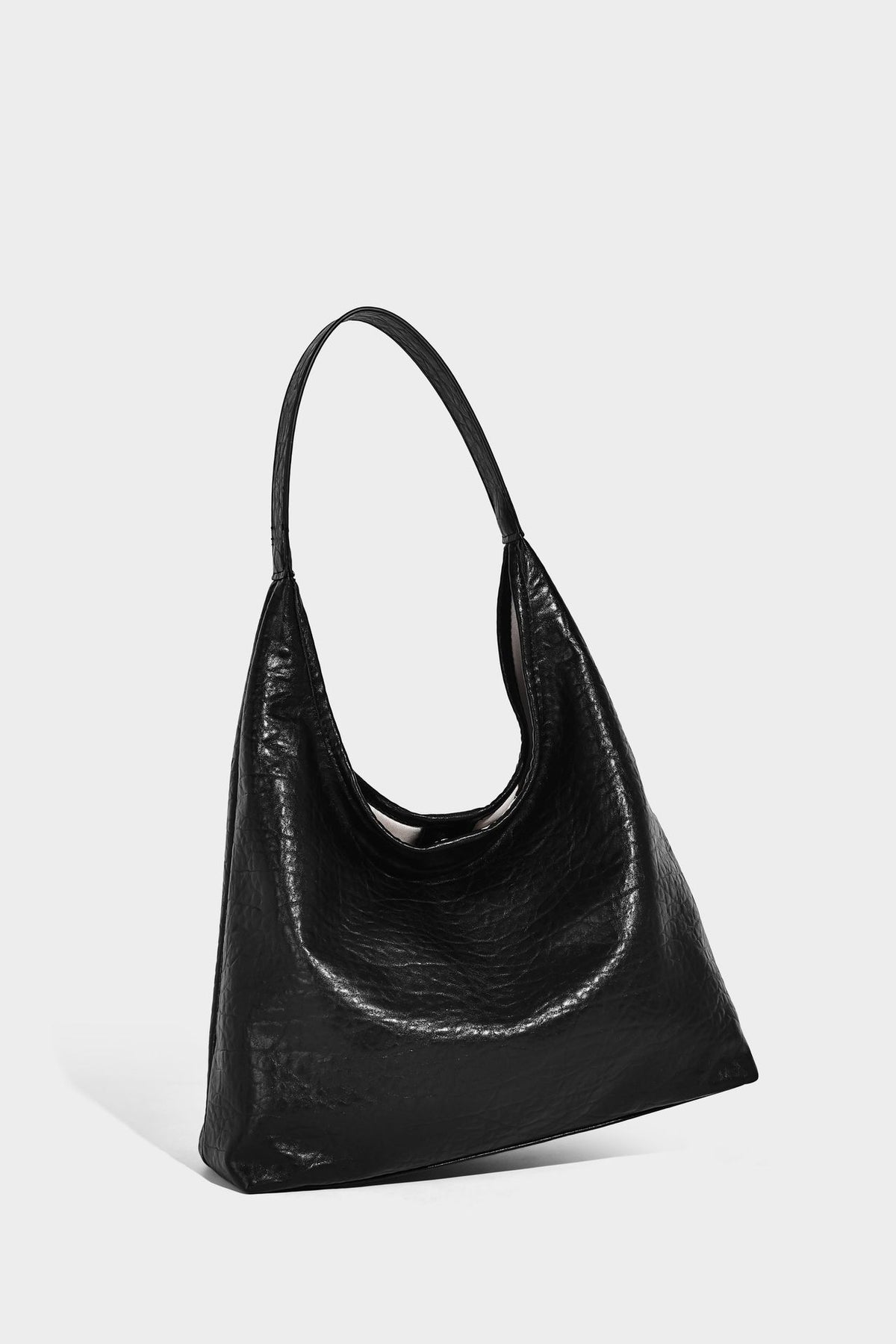 Slouchy hobo shoulder bag in pale yellow glossy pebbled leather-look finish with single shoulder strap and detachable front