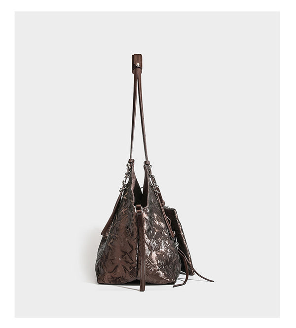 Slouchy crinkle-finish shoulder tote bag with silver hardware and attached zip pouch, detail view 10