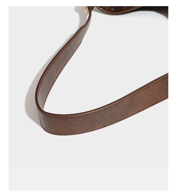 Lässig gewebte Schultertasche in Lederoptik mit Bindebandverschluss, goldfarbenen Metalldetails und einem Schulterriemen, Detailansicht 29