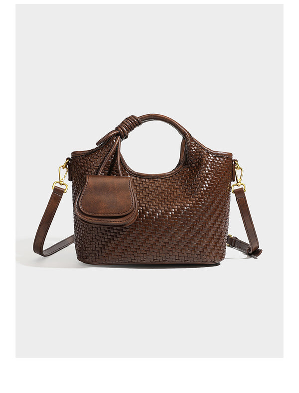 Woven leather-look tote bag in mocha brown with knotted top handle, front flap pocket, and detachable crossbody strap with