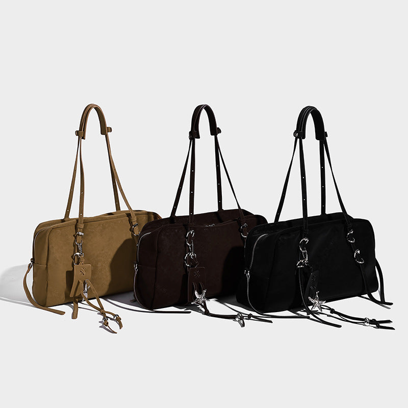 Structured rectangular matte suede-like shoulder bag with silver-tone hardware, zip closure, double top handles, and, detail