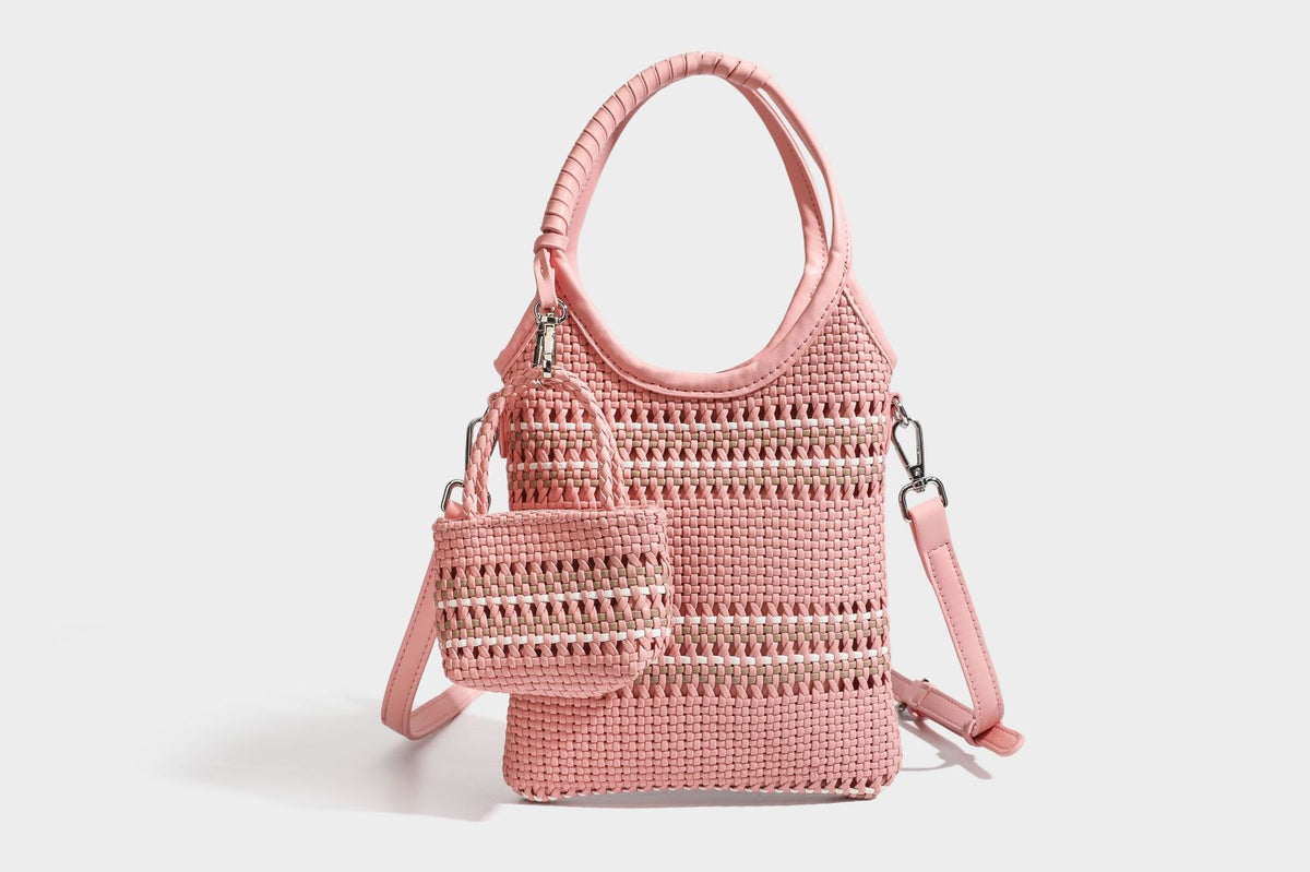 Color-block woven tote bag with rounded leather-look handles, detachable crossbody strap, and matching mini clip-on pouch in
