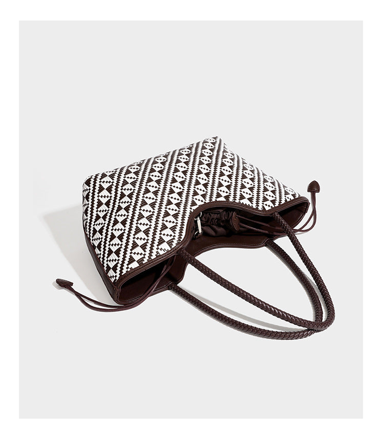 Woven geometric two-tone tote bag with braided shoulder straps and leather-look trim, detail view 16