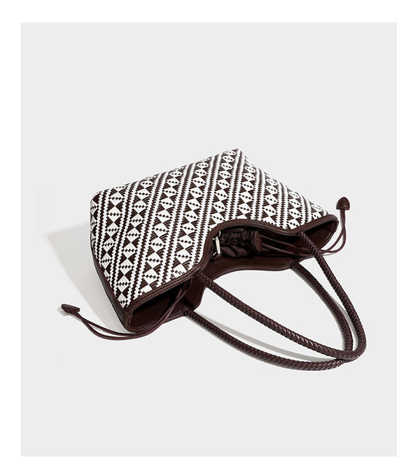 Woven geometric two-tone tote bag with braided shoulder straps and leather-look trim, detail view 16