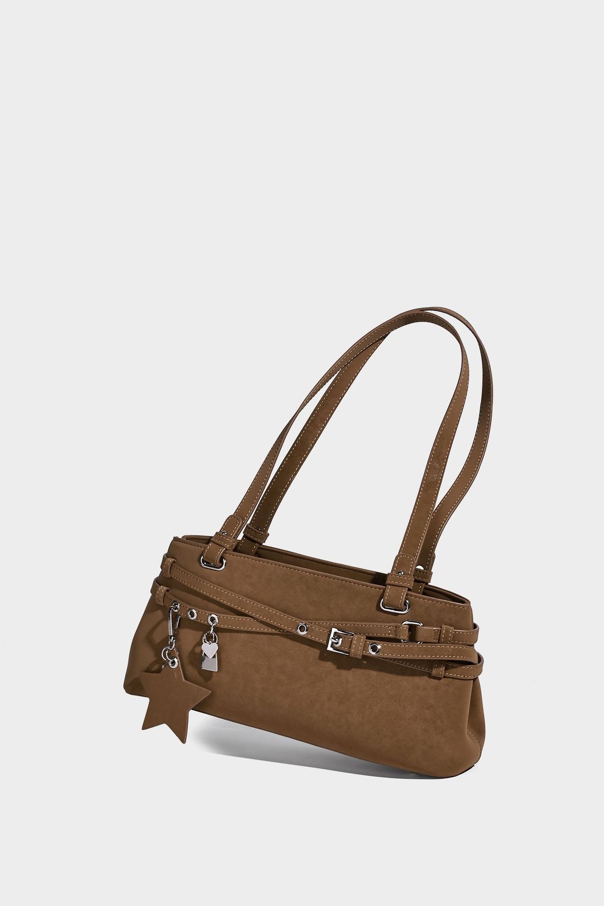 Structured trapezoid shoulder tote in dark brown matte suede-look finish with dual straps, wraparound belt bands