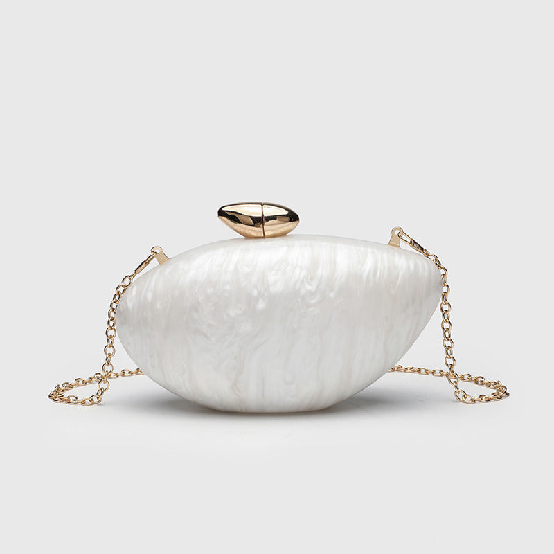 Oval hard-shell marbled gloss clutch bag with gold-tone kiss-lock clasp and detachable gold chain strap, detail view 6