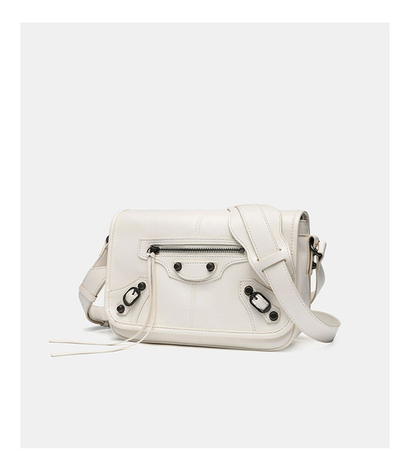 Small structured rectangular crossbody bag with crinkle leather-look finish, front zip pocket, gunmetal stud hardware, and