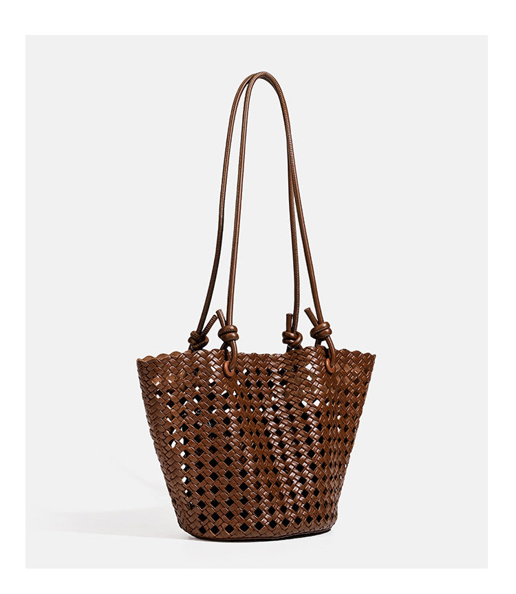 Open-weave lattice bucket tote bag with long knotted cord handles and tapered silhouette, detail view 18