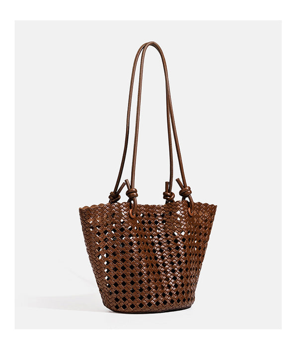Open-weave lattice bucket tote bag with long knotted cord handles and tapered silhouette, detail view 18