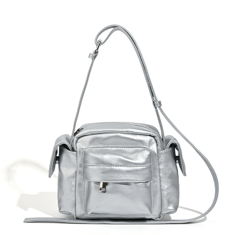 Boxy leather-look crossbody bag with front zip pockets, top zip closure, and long adjustable strap, detail view 5