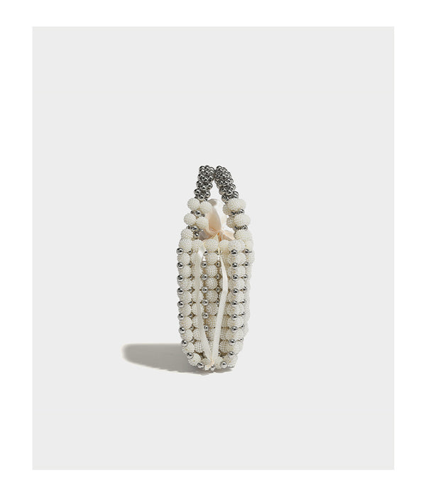 Small boxy pearl-bead mini top-handle bag with silver metallic bead accents, satin floral detail, and long beaded shoulder
