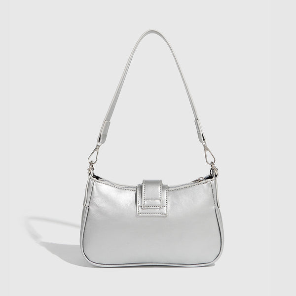 Compact metallic silver shoulder bag with glitter star appliqués, rhinestone star charms, front belt buckle strap, chunky