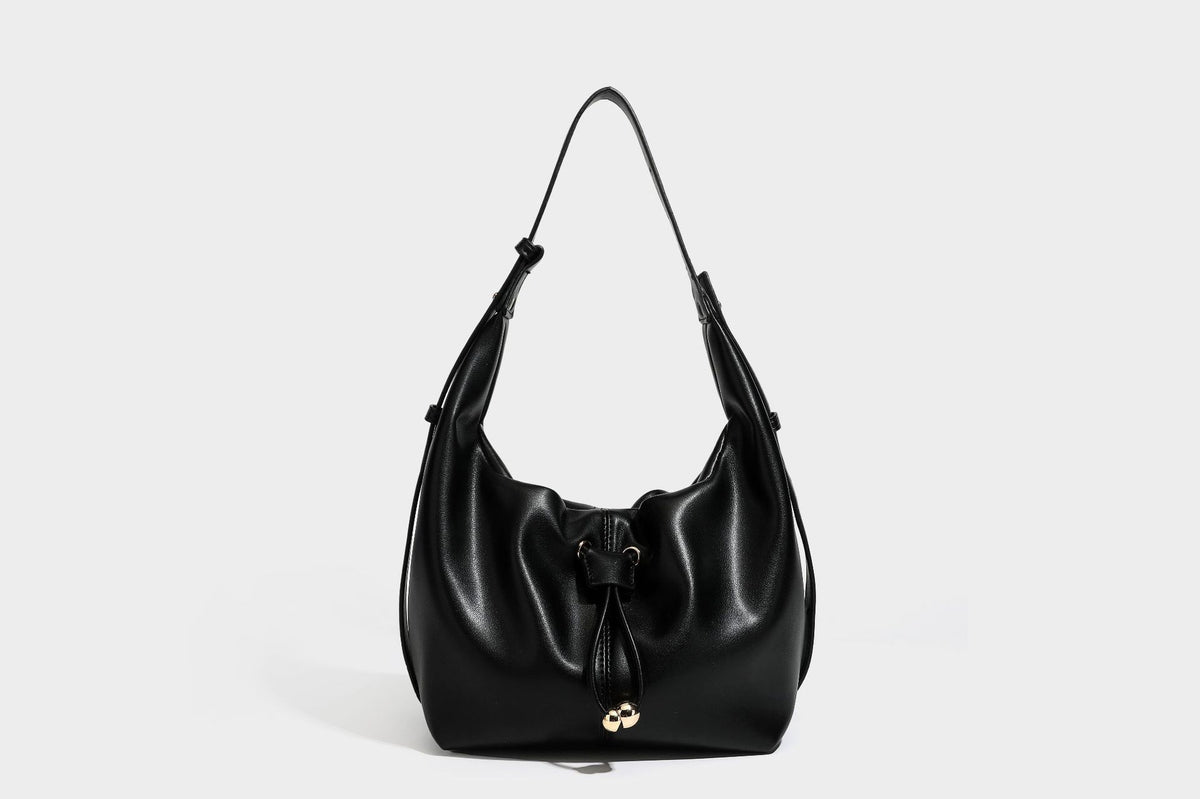 Slouchy hobo bag with smooth leather-look finish, drawstring cinch closure, and gold-tone bead hardware, detail view 33