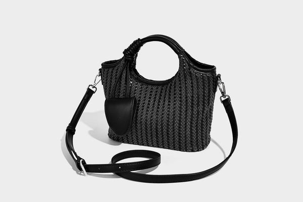 Small structured woven tote crossbody bag with ring top handle, leather-look brown trim, front patch pocket, and detachable