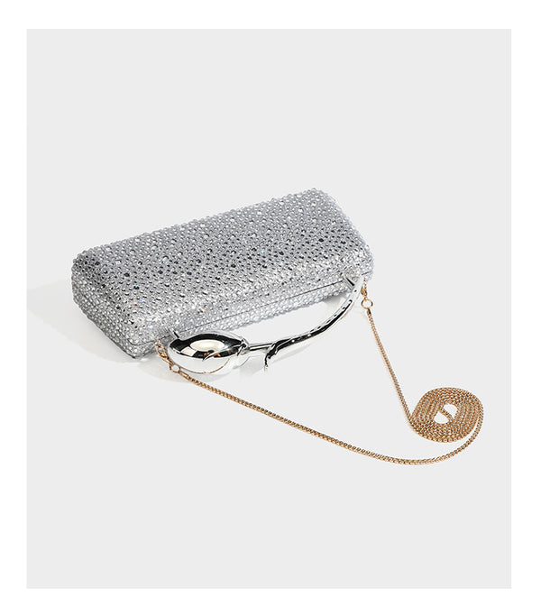 rectangular hard-case rhinestone evening clutch with sculptural gold-tone branch-and-bud top handle and detachable chain