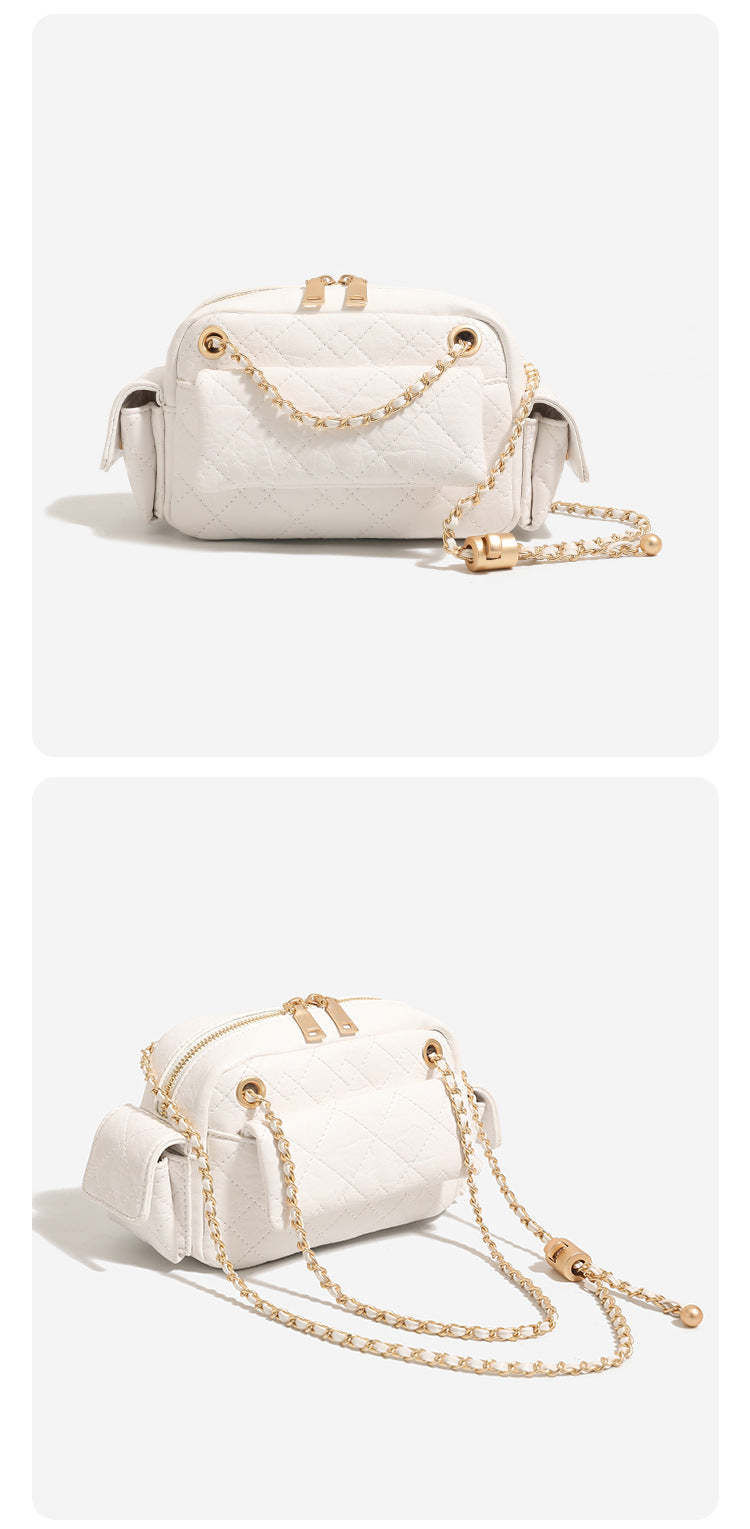 Compact quilted leather-look crossbody bag with gold-tone chain strap and double zip closure, detail view 11