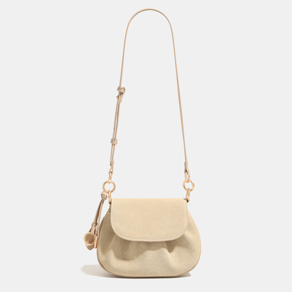 Small rounded flap crossbody saddle bag with gold-tone ring hardware and adjustable strap, detail view 8